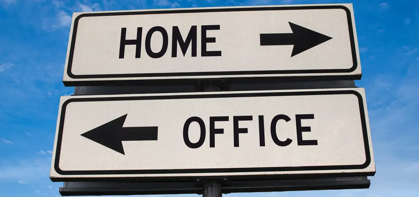 Road sign pointing in two directions. One direction is Home and the other is Office.